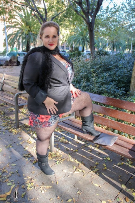 Hot mature BBW Sophia Lola showing her clothed big breasts outdoors