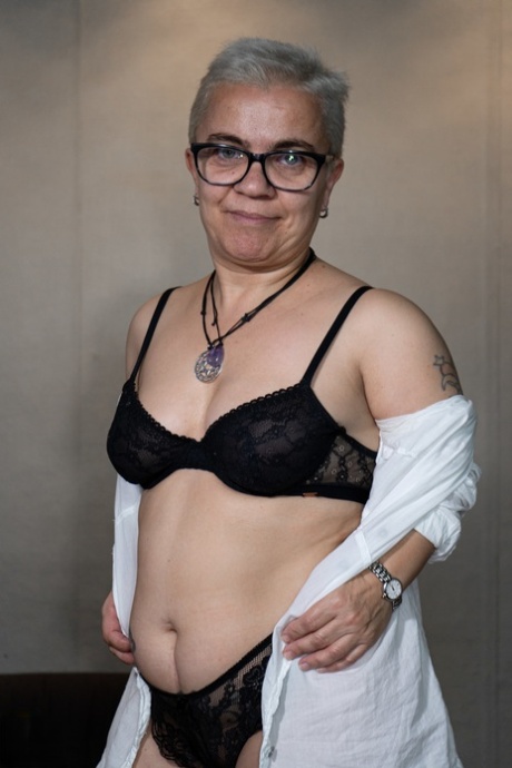 Short-haired amateur midget Sara One strips to her lingerie at the office