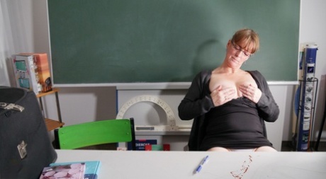 Schoolteacher Marie R exposes her hot body and masturbates in the classroom