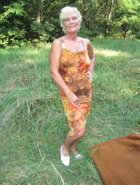 Amateur granny Paulene shows off her pussy & boobs outdoors in the grass
