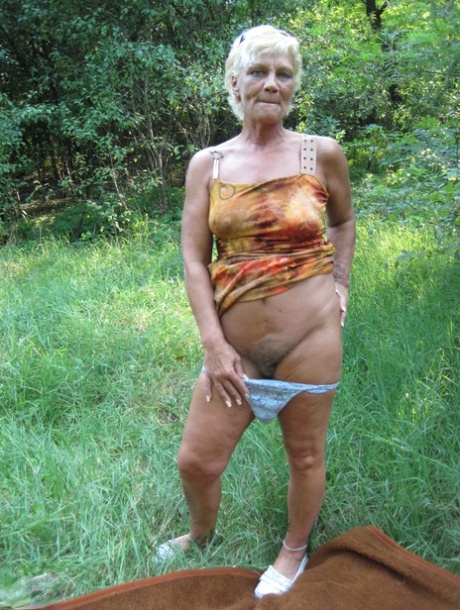 Amateur granny Paulene shows off her pussy & boobs outdoors in the grass