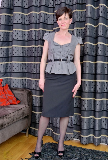 Mature housewife Olivia G takes off her mommy clothes to tease nude in nylons