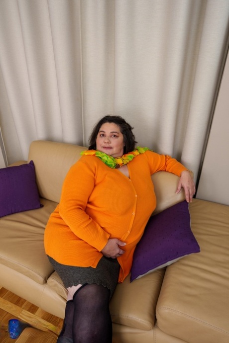 Mature fatty Edina flaunts her big booty while teasing in stockings