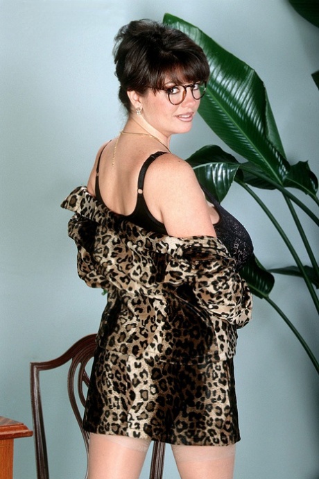 Mature lady with glasses Diane Poppos reveals & licks her large natural tits