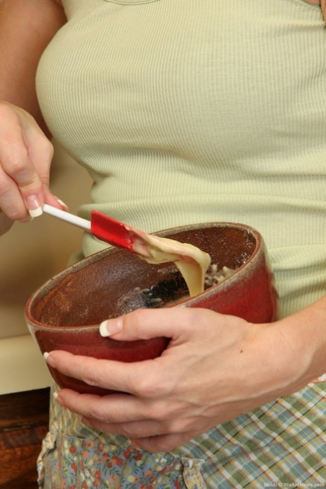 Young housewife Heidi strips and shows off her hairy twat while baking a cake