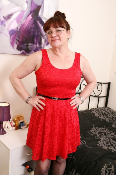 Brunette granny with big boobs Dianne D undresses and toys herself