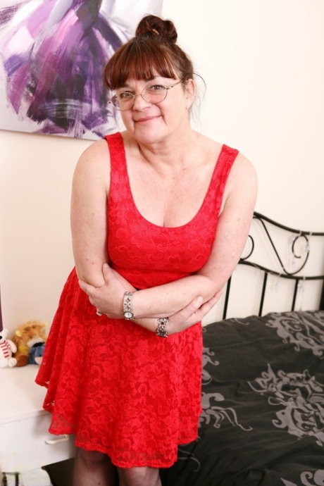 Brunette granny with big boobs Dianne D undresses and toys herself