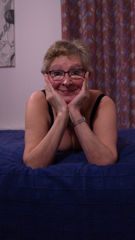 Chubby German granny Angie teasing in black lingerie & stockings